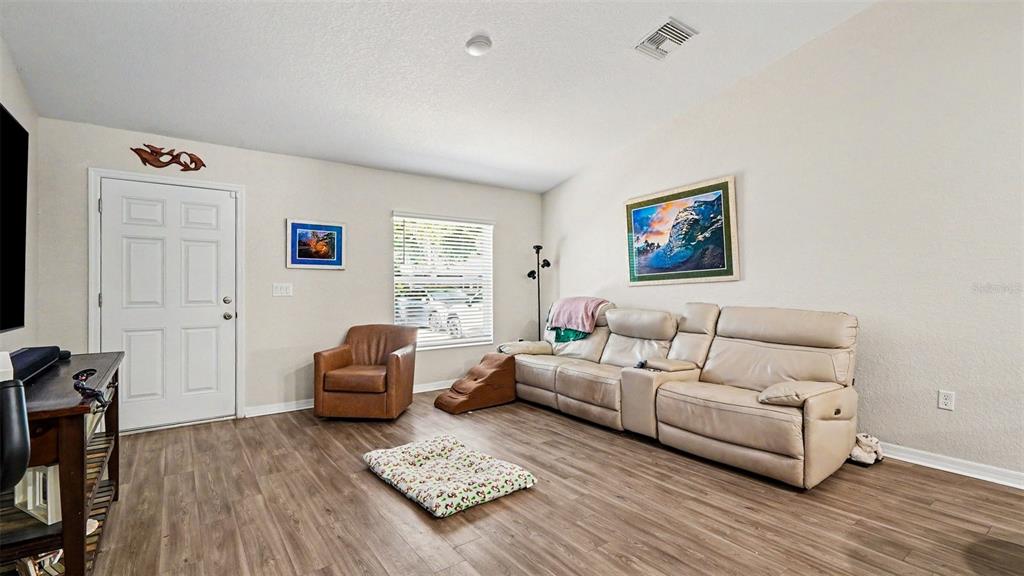 6201 East Peach Street Inverness, FL 34452 - Photo 4 of 30 a living room with furniture and a window