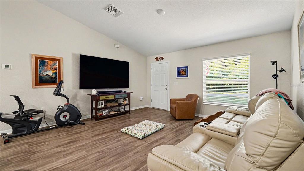 6201 East Peach Street Inverness, FL 34452 - Photo 6 of 30 a living room with furniture and a flat screen tv