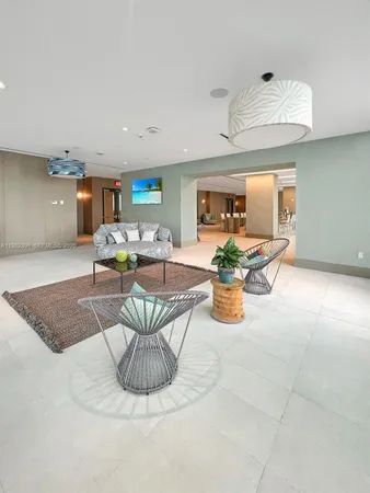 a living room filled with furniture and a table