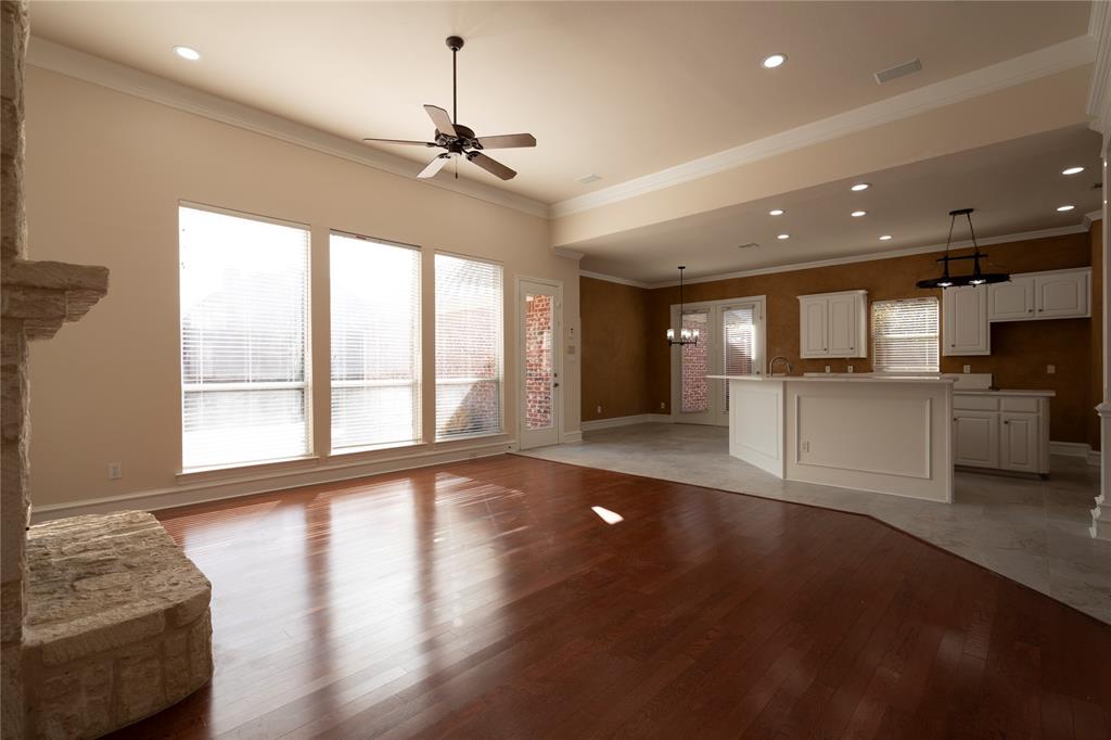 1425 Kingsmill Court Coppell, TX 75019 - Photo 13 of 30 a view of an empty room with a window and wooden floor
