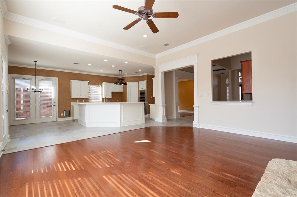 1425 Kingsmill Court Coppell, TX 75019 - Photo 14 of 30 a view of a kitchen with wooden floor and a kitchen