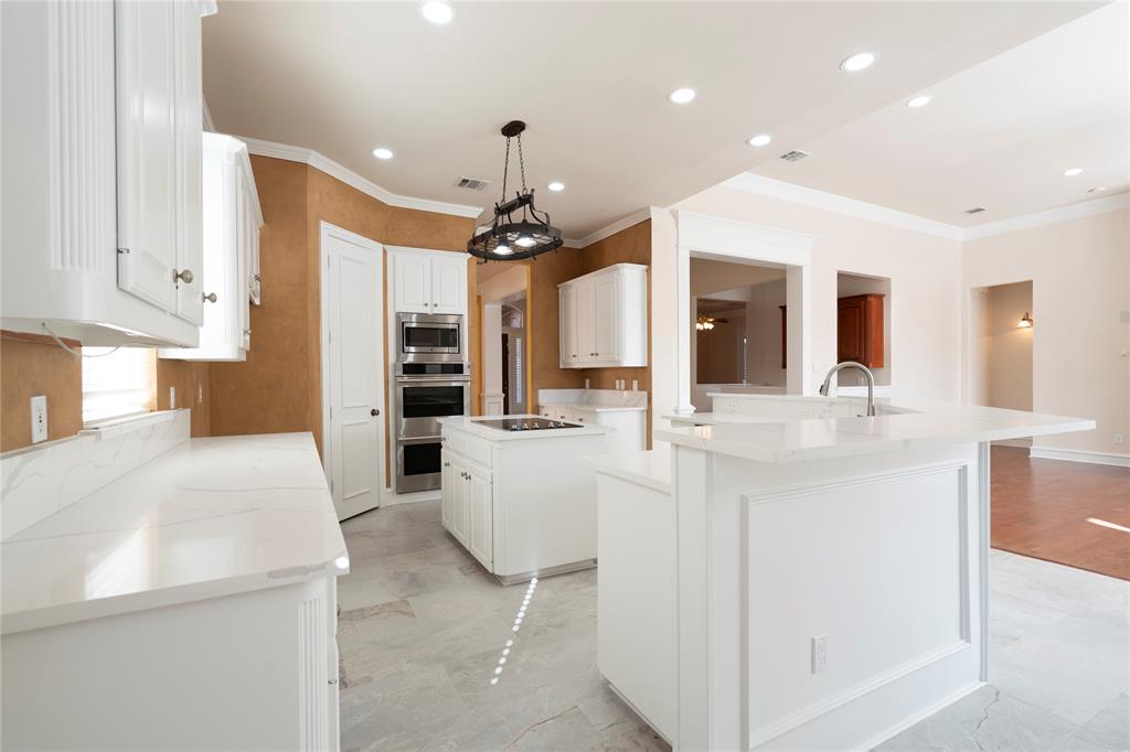 1425 Kingsmill Court Coppell, TX 75019 - Photo 19 of 30 a view of living room with kitchen island furniture and flat screen tv