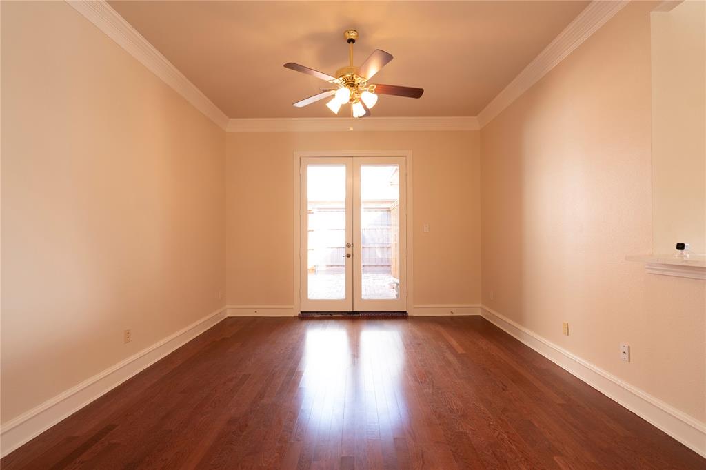 1425 Kingsmill Court Coppell, TX 75019 - Photo 2 of 30 a view of an empty room with wooden floor and a window