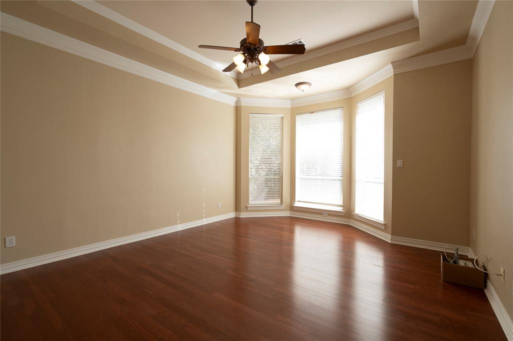 1425 Kingsmill Court Coppell, TX 75019 - Photo 22 of 30 a view of livingroom with window and wooden floor