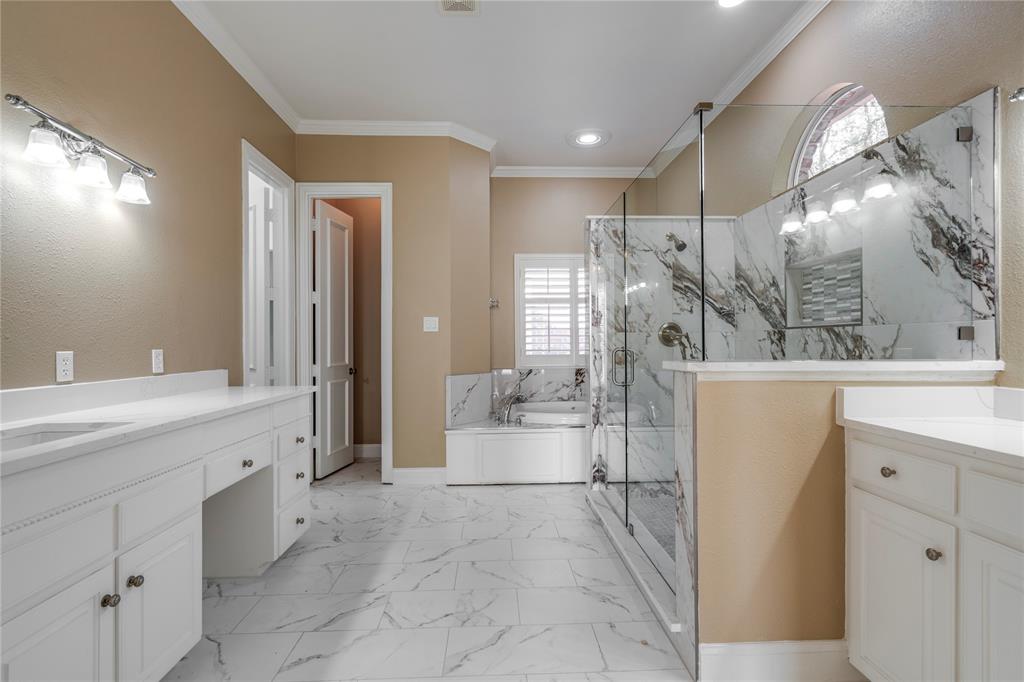 1425 Kingsmill Court Coppell, TX 75019 - Photo 27 of 30 a spacious bathroom with a granite countertop sink a toilet and shower