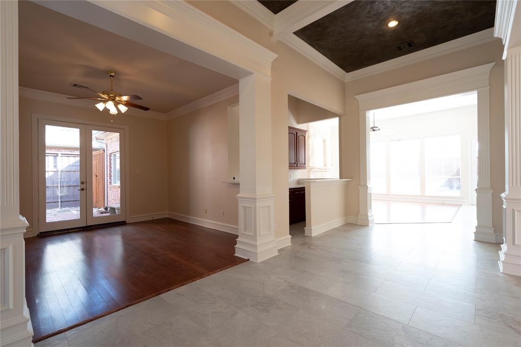 1425 Kingsmill Court Coppell, TX 75019 - Photo 6 of 30 an empty room with wooden floor and windows