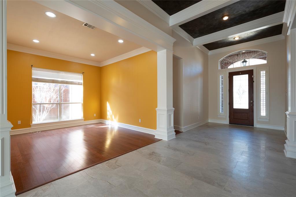 1425 Kingsmill Court Coppell, TX 75019 - Photo 9 of 30 an empty room with wooden floor and windows