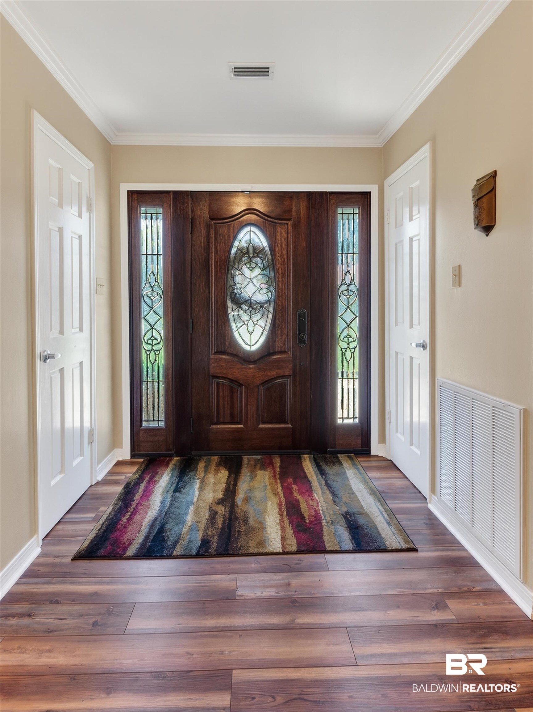 1271 Spring Valley Drive South Mobile, AL 36693 - Photo 6 of 56 Foyer entrance featuring plenty of natural light, dark wood finished floors, and ornamental molding