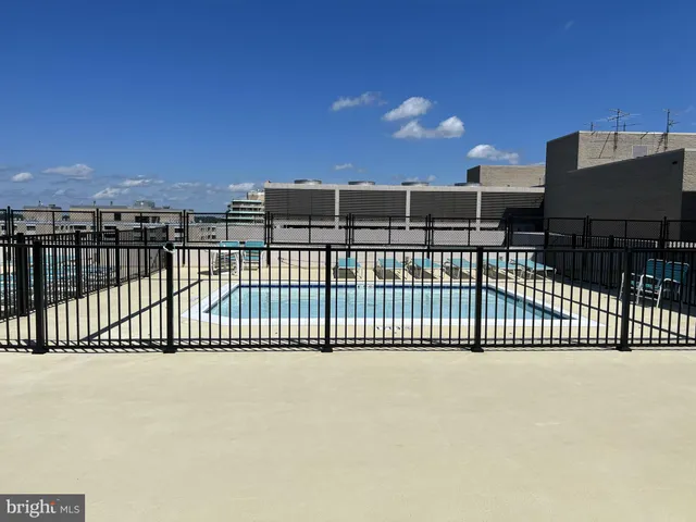 a kitchen with kitchen island a sink and stove
