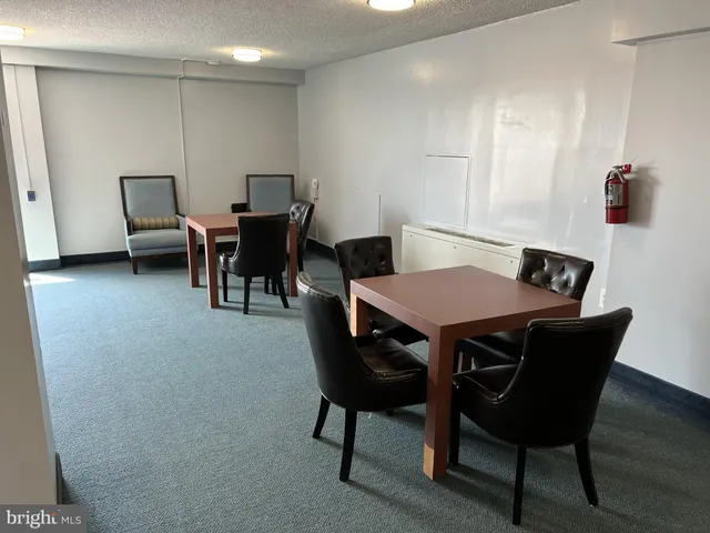 a view of a livingroom with furniture and staircase