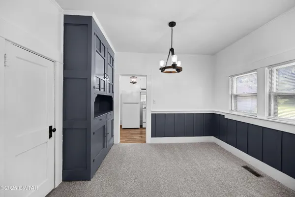 a kitchen with stainless steel appliances a refrigerator and a sink