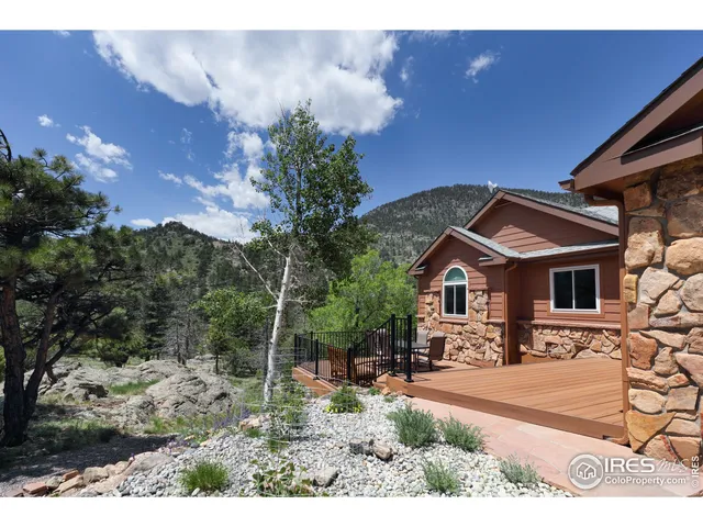 a view of a patio with wooden floor