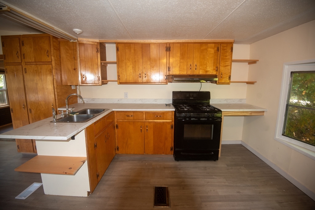 20 Dana Road Barre, MA 01005 - Photo 12 of 38 a kitchen with stainless steel appliances a stove sink and cabinets