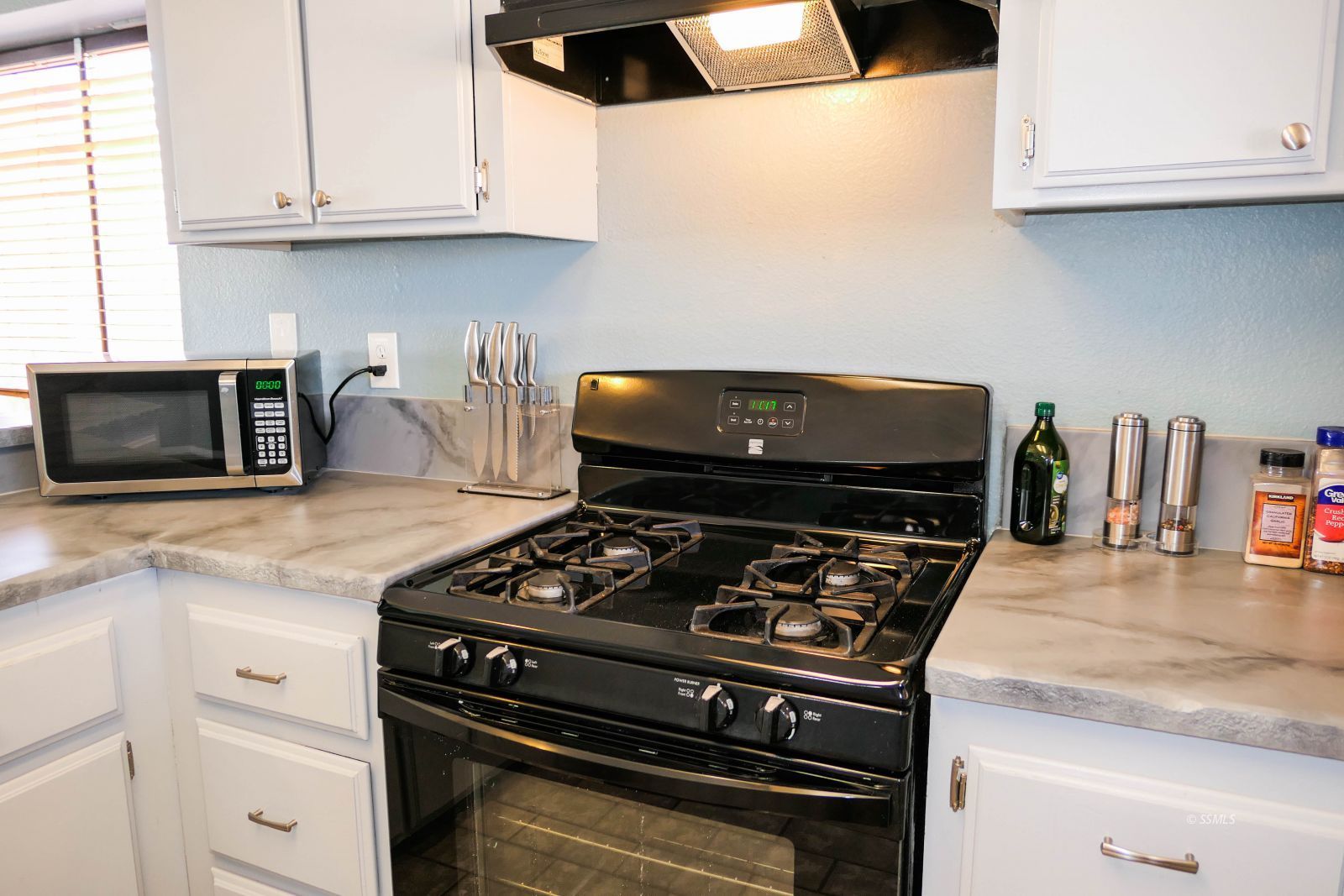 601 Heather Court Ridgecrest, CA 93555 - Photo 15 of 45 a kitchen with granite countertop cabinets and steel appliances