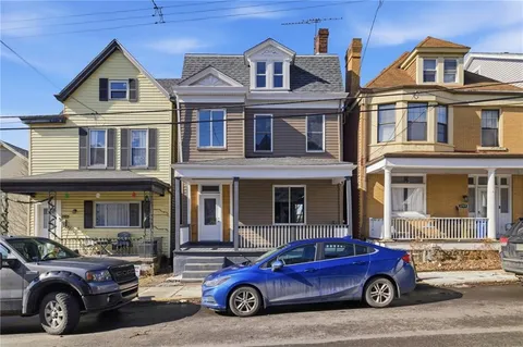 a car parked in front of a house