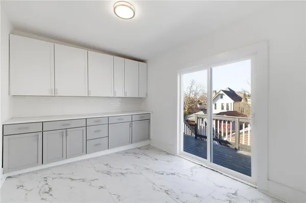 a view of staircase with wooden floor and a window
