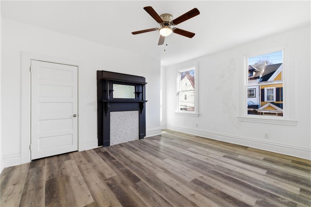 3707 Atkins Street Pittsburgh, PA 15212 - Photo 21 of 41 a view of a room with wooden floor and ceiling fan