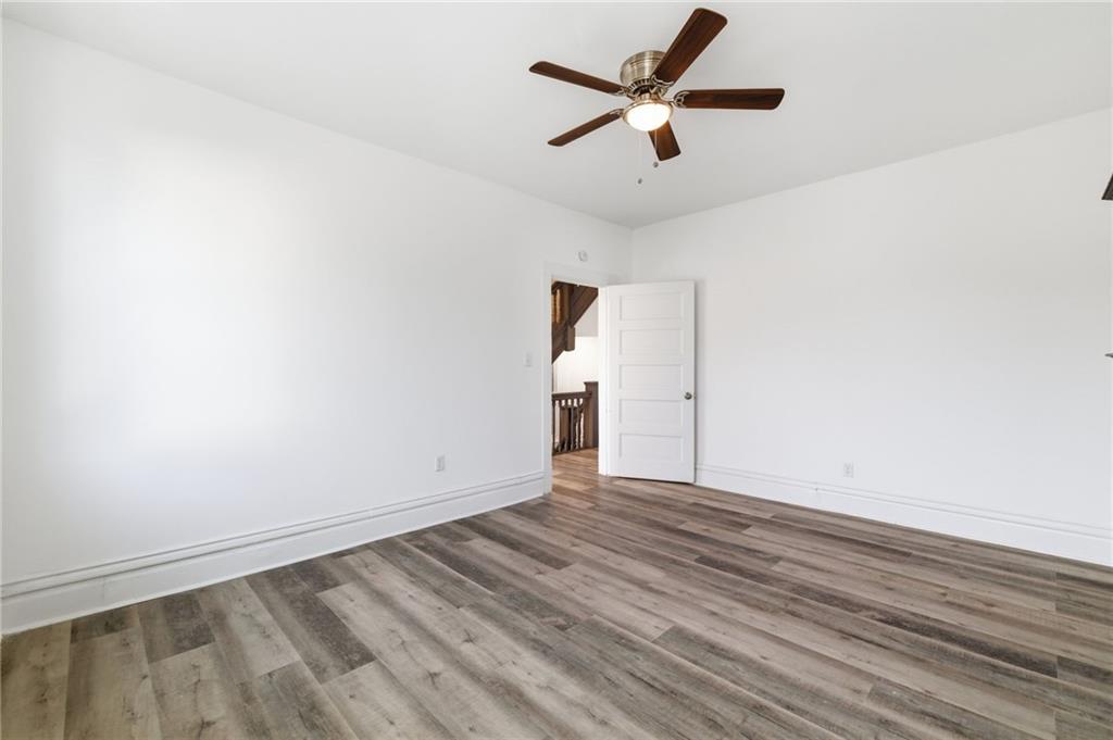 3707 Atkins Street Pittsburgh, PA 15212 - Photo 22 of 41 an empty room with a ceiling fan and window