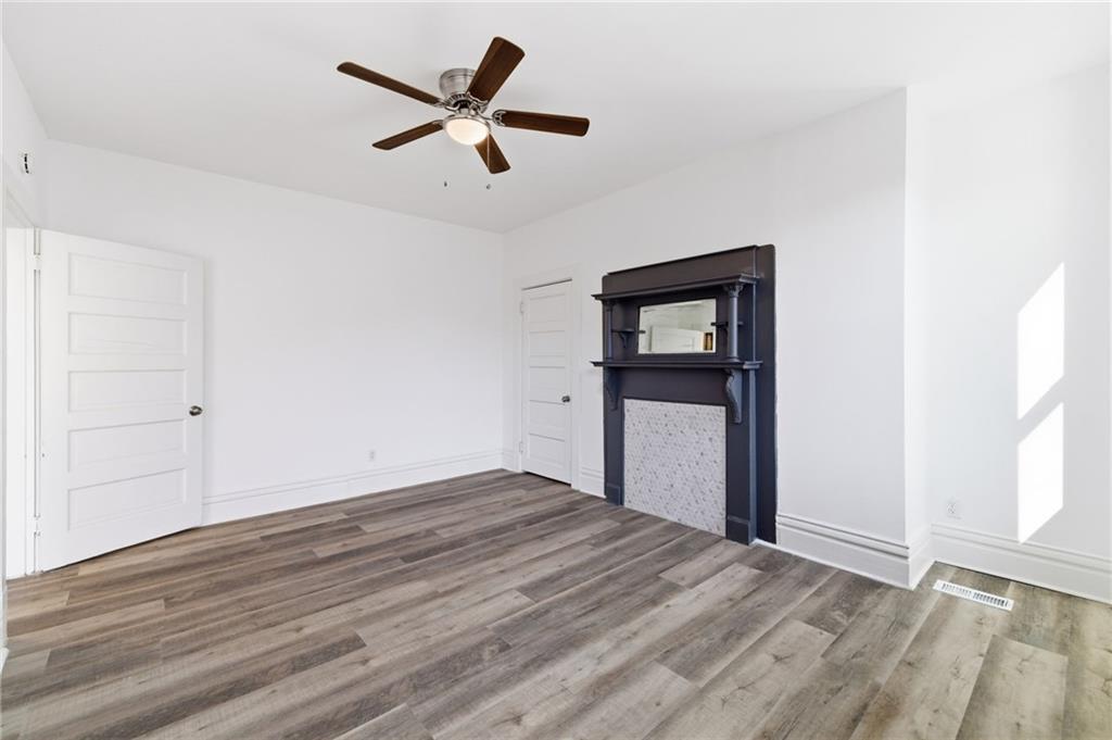 3707 Atkins Street Pittsburgh, PA 15212 - Photo 23 of 41 a view of empty room with wooden floor and ceiling fan