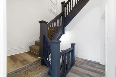 an empty room with closet and a ceiling fan
