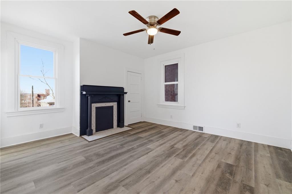 3707 Atkins Street Pittsburgh, PA 15212 - Photo 25 of 41 wooden floor in an empty room with a window