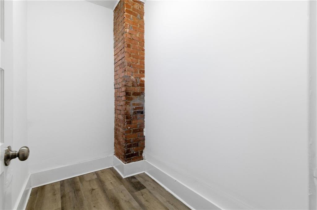 3707 Atkins Street Pittsburgh, PA 15212 - Photo 27 of 41 a view of a room with window and brick walls