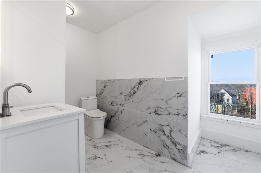3707 Atkins Street Pittsburgh, PA 15212 - Photo 31 of 41 a bathroom with a sink and a toilet