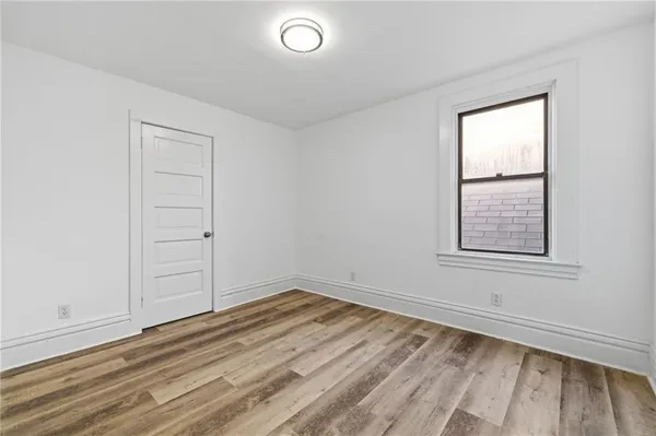 a view of a house with wooden deck