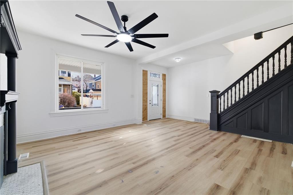 3707 Atkins Street Pittsburgh, PA 15212 - Photo 7 of 41 a view of an empty room with window and wooden floor