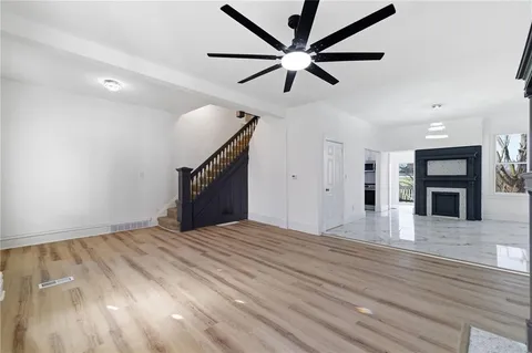 a view of an empty room with a fireplace