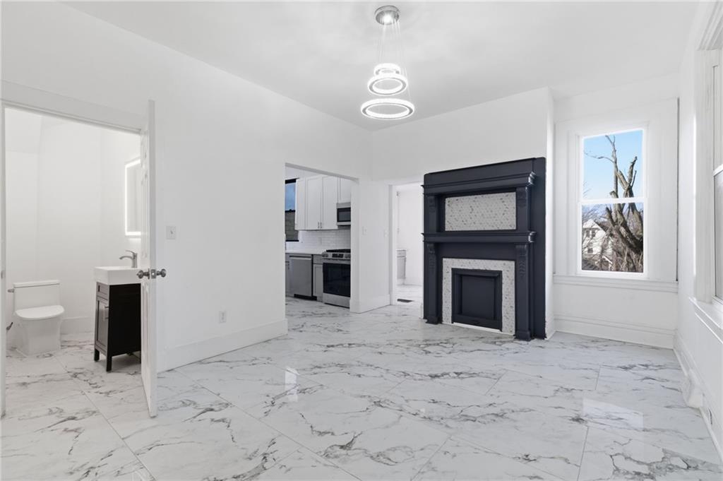 3707 Atkins Street Pittsburgh, PA 15212 - Photo 10 of 41 a view of a livingroom with a fireplace