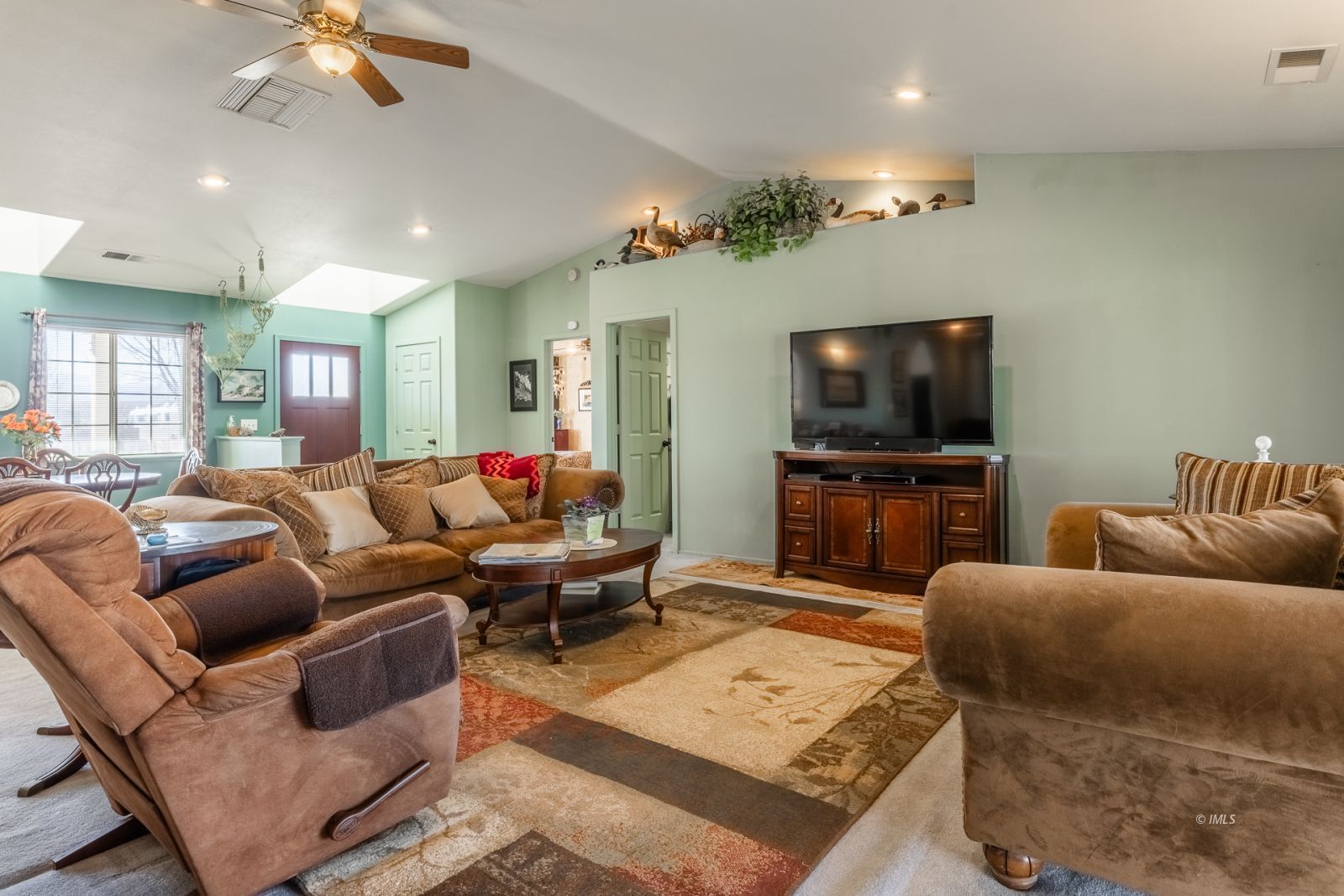 68 Ronda Lane Bishop, CA 93514 - Photo 12 of 28 a living room with furniture and a flat screen tv