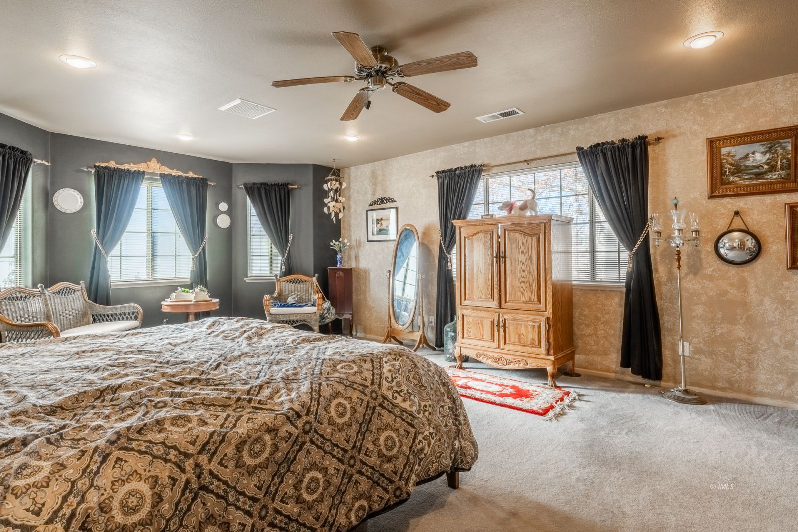 68 Ronda Lane Bishop, CA 93514 - Photo 14 of 28 a bedroom with a bed closet and flat tv screen