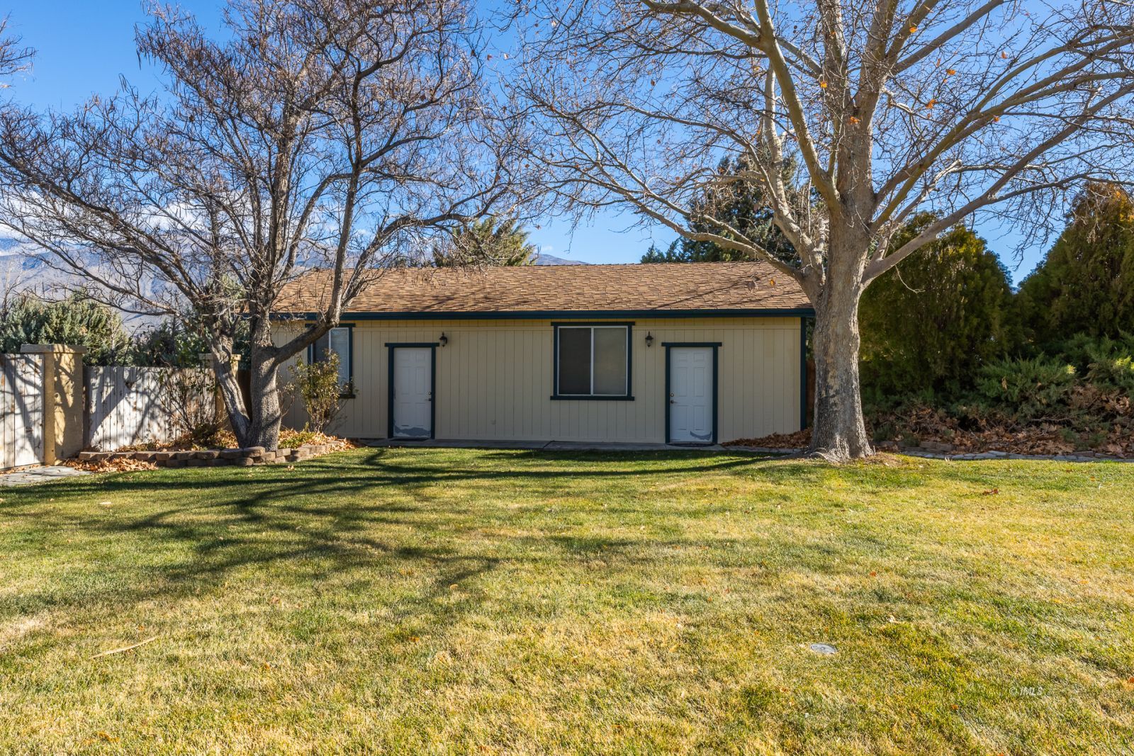 68 Ronda Lane Bishop, CA 93514 - Photo 17 of 28 a view of a house with a yard and large trees