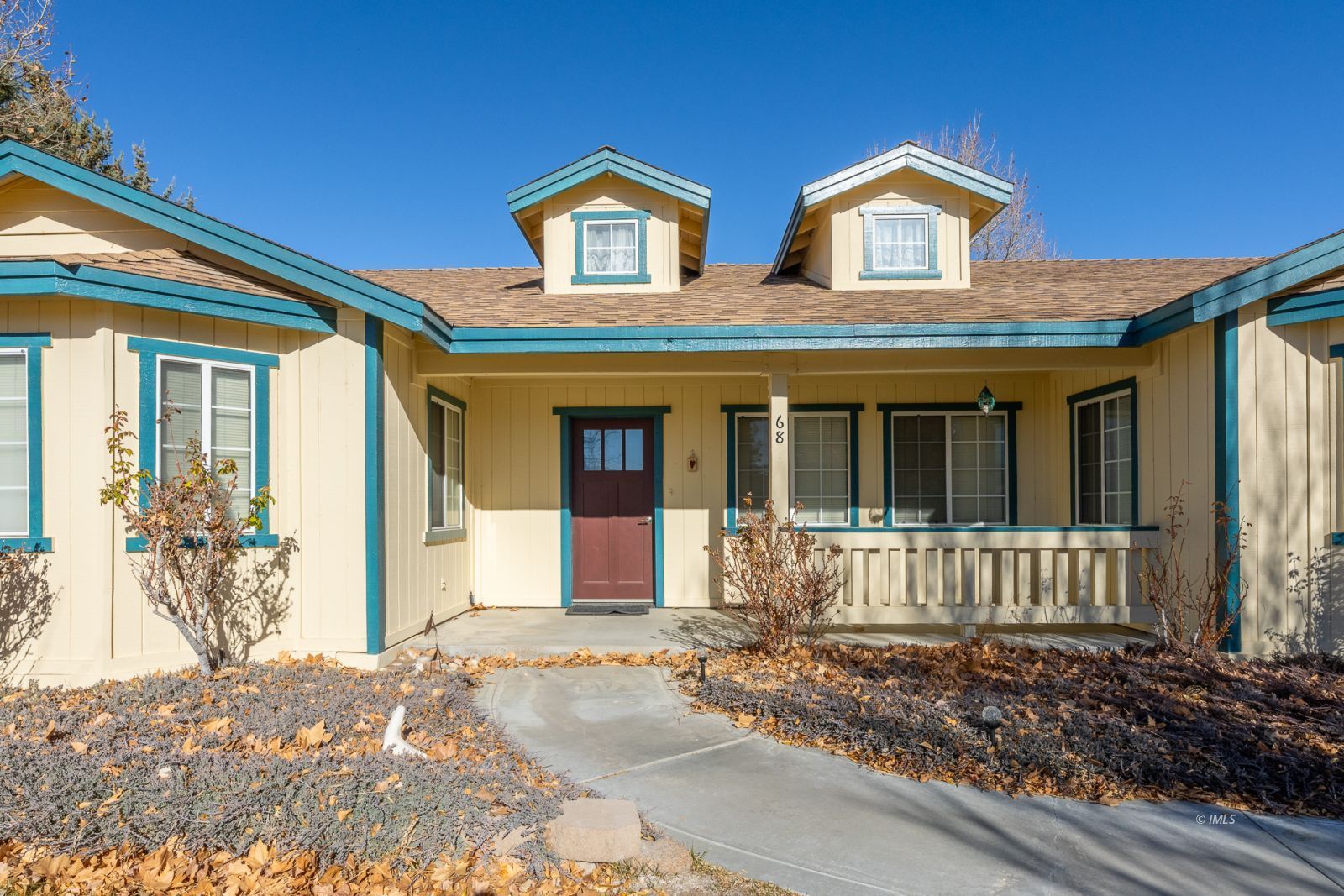 68 Ronda Lane Bishop, CA 93514 - Photo 2 of 28 a front view of a house with garden