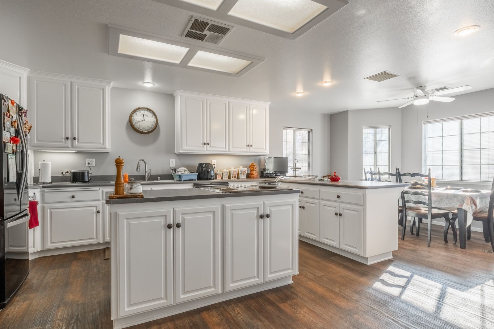 68 Ronda Lane Bishop, CA 93514 - Photo 5 of 28 a kitchen with sink cabinets and wooden floor