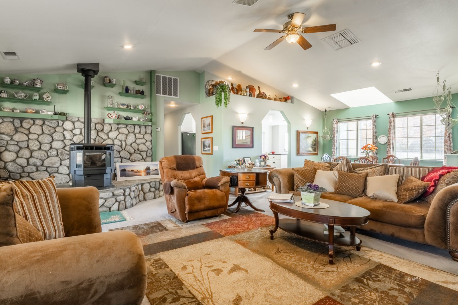 68 Ronda Lane Bishop, CA 93514 - Photo 10 of 28 a living room with furniture ceiling fan and a rug