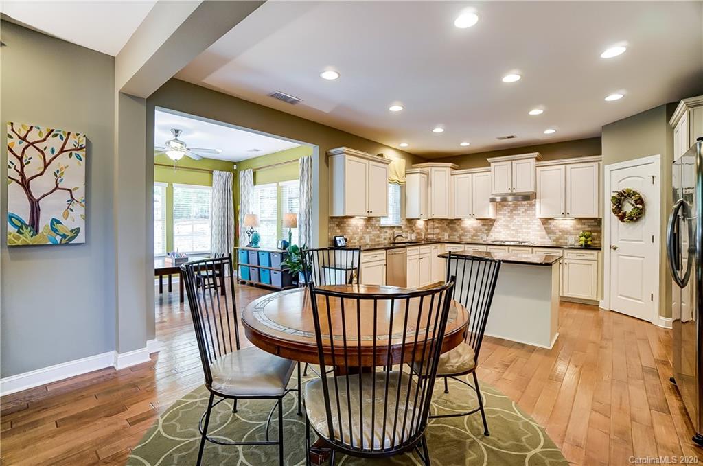 692 Old Cove Road Tega Cay, SC 29708 - Photo 13 of 44 a dining room with furniture and window