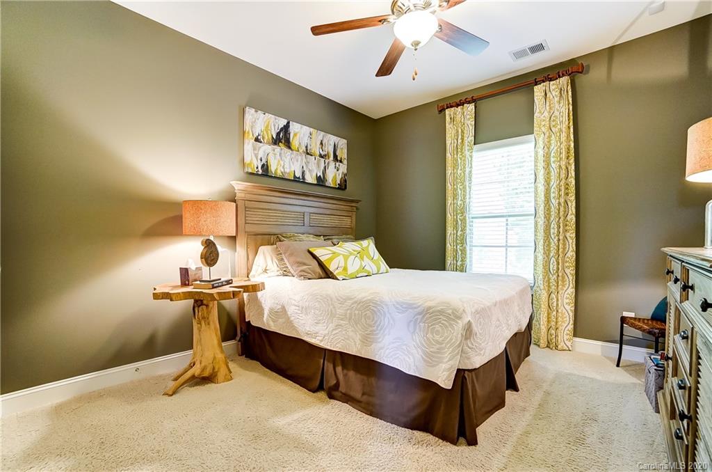 692 Old Cove Road Tega Cay, SC 29708 - Photo 19 of 44 a bedroom with a bed and window