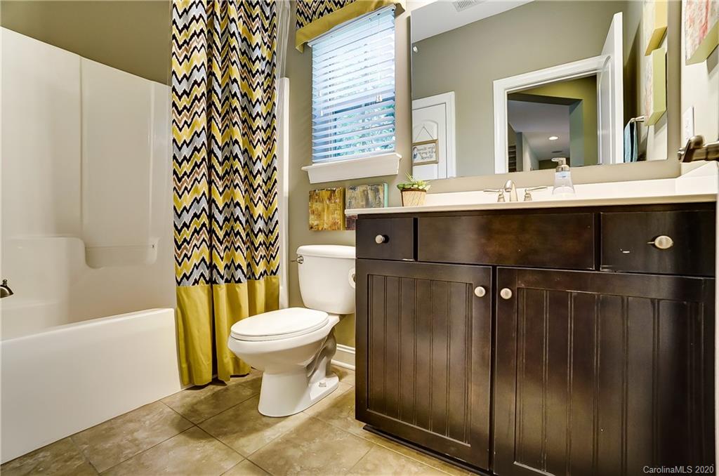 692 Old Cove Road Tega Cay, SC 29708 - Photo 20 of 44 a bathroom with a sink toilet and shower