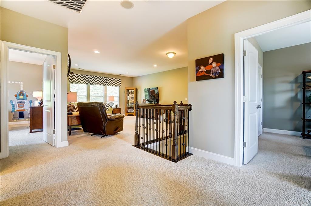 692 Old Cove Road Tega Cay, SC 29708 - Photo 21 of 44 a view of a livingroom with furniture and a ceiling fan