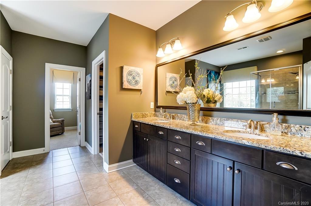 692 Old Cove Road Tega Cay, SC 29708 - Photo 25 of 44 a bathroom with a double vanity sink and a mirror