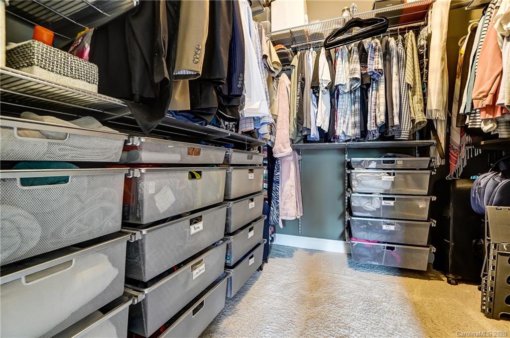 692 Old Cove Road Tega Cay, SC 29708 - Photo 27 of 44 a view of walk in closet with clothes and shoes