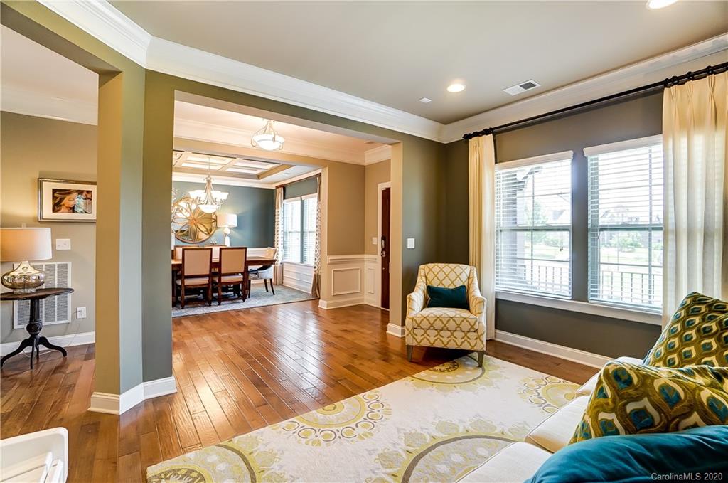 692 Old Cove Road Tega Cay, SC 29708 - Photo 4 of 44 a bedroom with furniture and a large window