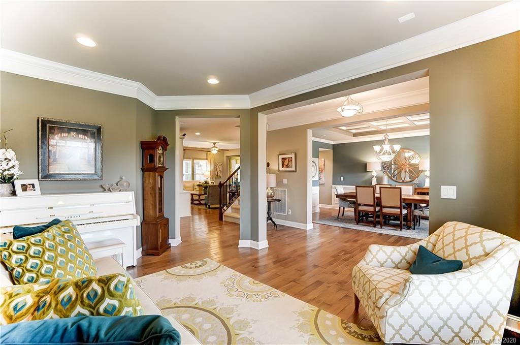 692 Old Cove Road Tega Cay, SC 29708 - Photo 5 of 44 a living room with furniture and wooden floor