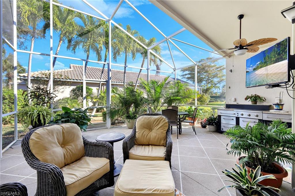 9354 Springview Loop Estero, FL 33928 - Photo 1 of 30 a couple of chairs sitting in patio with a chair and potted plants