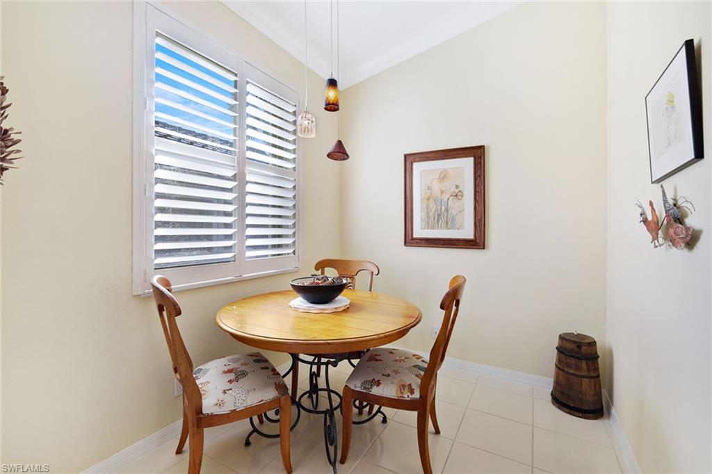 9354 Springview Loop Estero, FL 33928 - Photo 13 of 30 a dining room with furniture and window