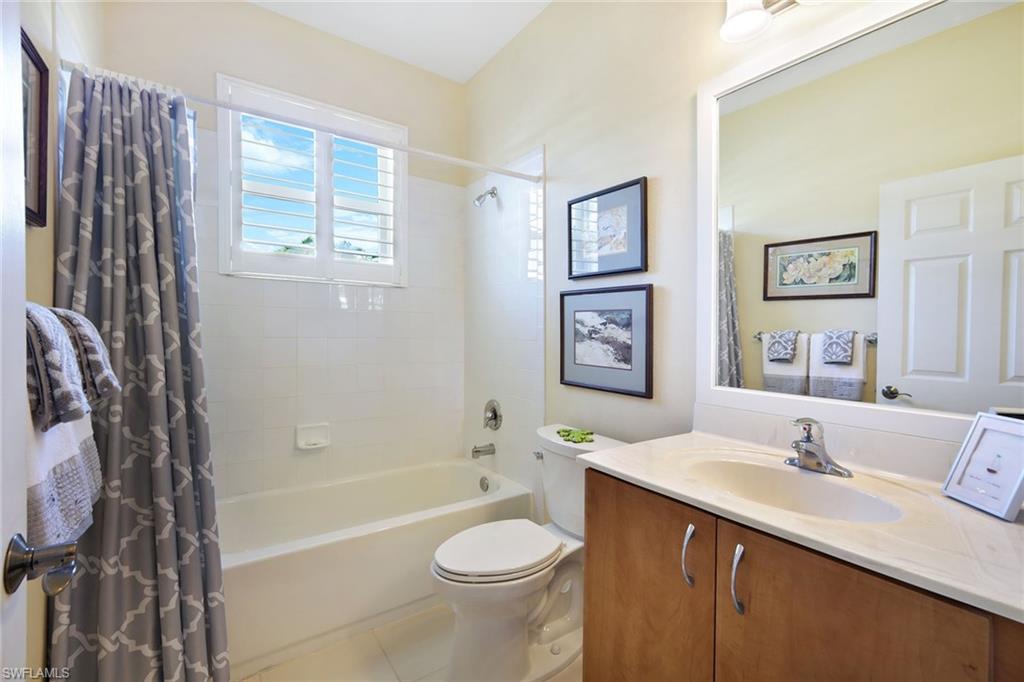 9354 Springview Loop Estero, FL 33928 - Photo 20 of 30 a bathroom with a sink toilet and bathtub