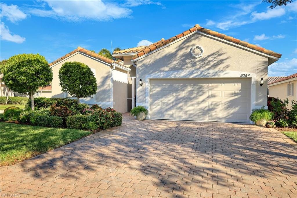 9354 Springview Loop Estero, FL 33928 - Photo 2 of 30 a view of a house with a yard