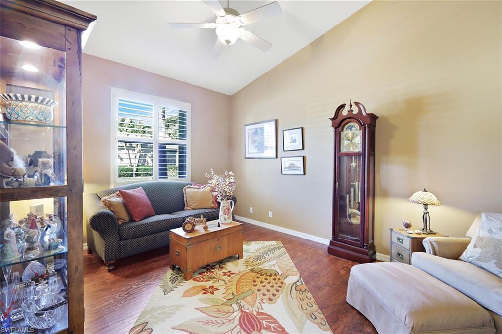 9354 Springview Loop Estero, FL 33928 - Photo 21 of 30 a spacious bedroom with a bed a couch and a window